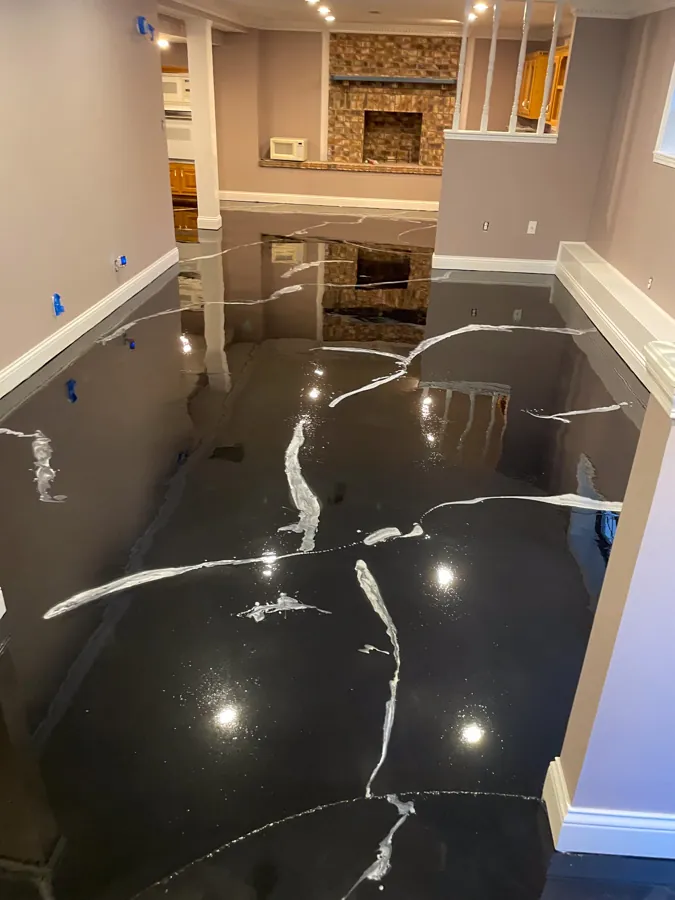 High-gloss black marble-look epoxy basement floor, residential epoxy flooring serving Nashville, TN