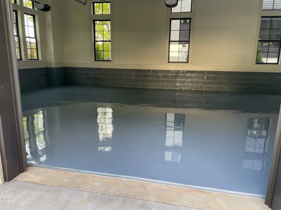 Reflective blue-gray epoxy garage floor, industrial flooring serving Nashville, TN