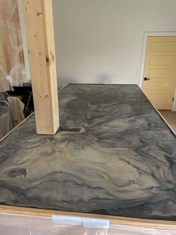 Gray metallic epoxy floor being installed, concrete floor coating serving Nashville, TN